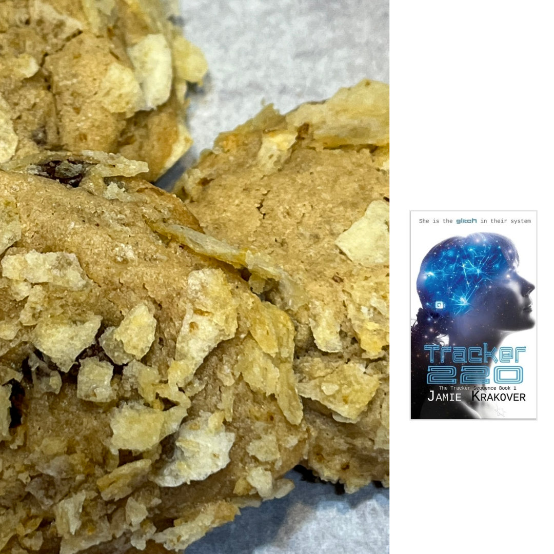 Broken Chip Cookies: chocolate chip cookies dusted with crushed potato chips on a white plate, with the cover of the YA novel TRACKER 220 by Jamie Krakover in the right-hand column