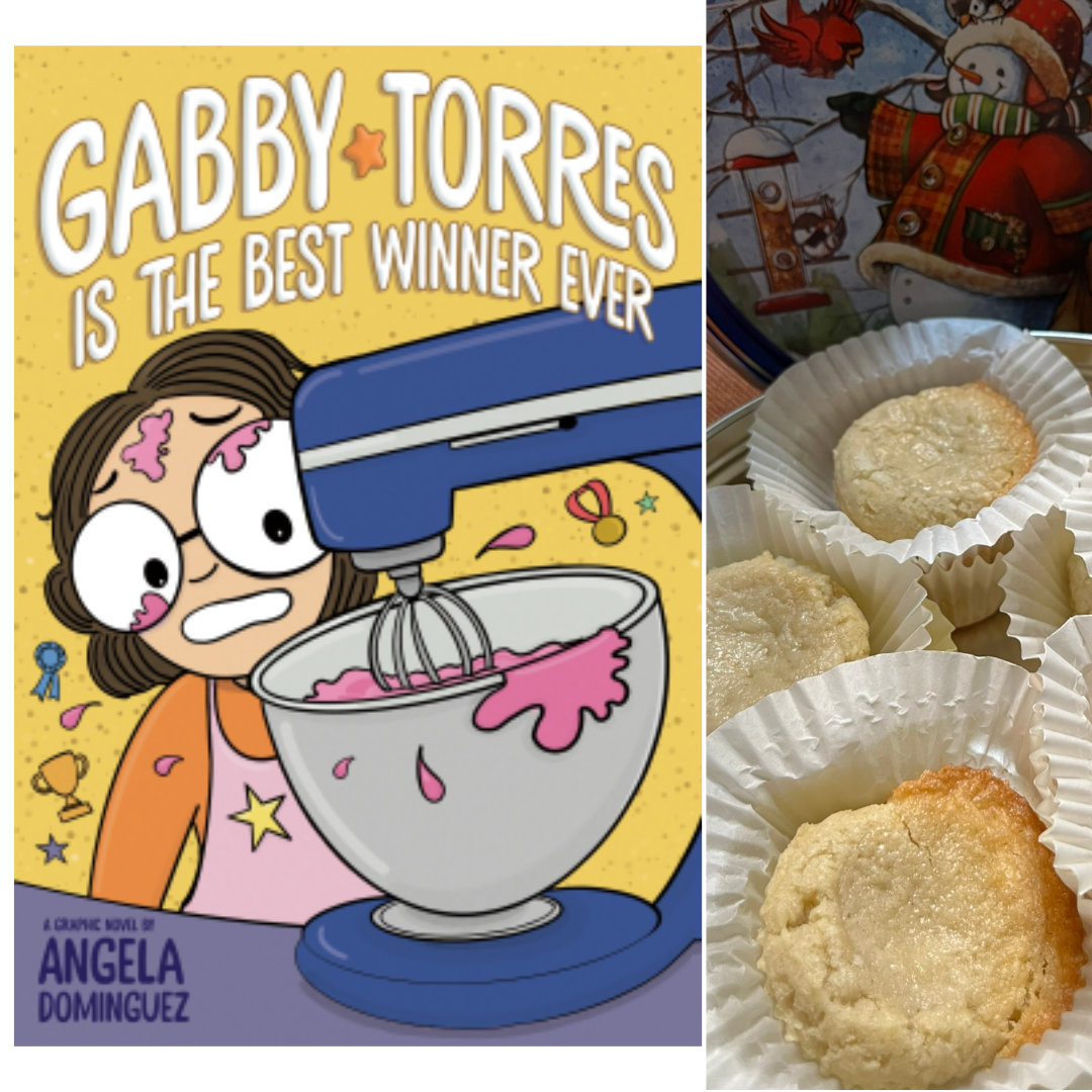 illustrated cover of GABBY TORRES IS THE BEST WINNER EVER by Angela Dominguez. A cartoon-ish drawing of a girl with short, curly, brown hair and large glasses, wearing an orange shirt and a pink apron is mixing something pink in a large, blue stand mixer. There are pink splatters on her shirt, forehead, and glasses. She has a worried grimace on her face as she watches the mixer do its work. To the right of the book cover is a close-up photo of Gooey Butter Cookies in white cupcake wrappers, arranged inside a snowman cookie tin. Soft butter cookies, golden around the edges, topped with a layer of gooey, sweet, buttery custard-like filling.