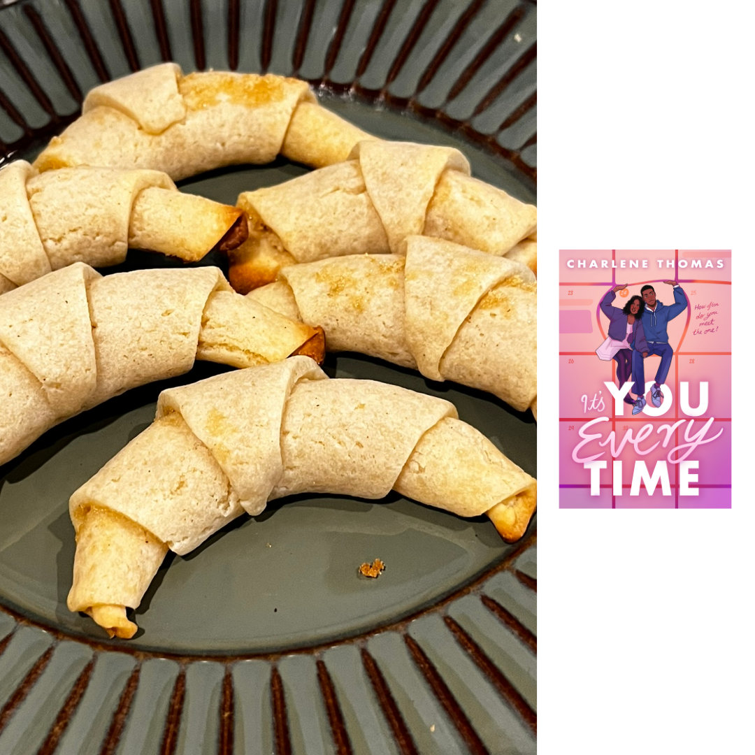 Cropped photograph of a green plate with a brown starburst pattern around the rim, with 6 Croissant Cookies: a flaky pie-crust inspired dough, filled with brown sugar and rolled up to form crescents. To the right of the photograph, against a white background, is a thumbnail image of the cover of IT'S YOU EVERY TIME by Charlene Thomas - Illustration of two black teenagers: a girl wearing a soft pink knee-length dress with a purple jacket and black tights, and a boy wearing blue jeans and a blue hoodie, are sitting inside the gridlines of a calendar page as if it's a 3-dimensional object. They're pushing out on the borders of the date block they are sitting inside of, because it's not quite big enough to contain them. The title is written in a combination of bold, all-caps bold text for the words YOU and TIME and a flowing script font for the rest of the title. The tagline How often do you meet the one? is written in a font resembling handwriting on the calendar date beside the one the two main characters are sitting in.